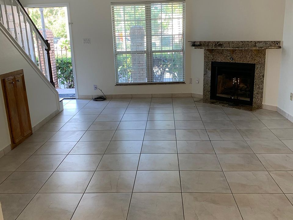 Large open living room with under tha stairs storage