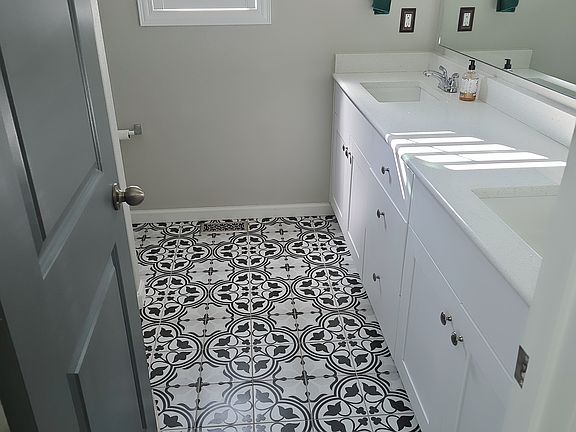 Beautiful tiles. Installed by a master. Quart counter top.
