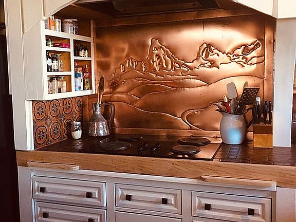 Copper etched backsplash