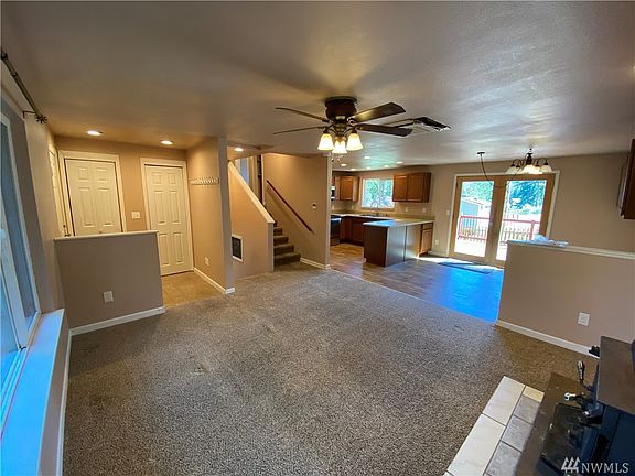 Living room on main floor, open to kitchen and dining room