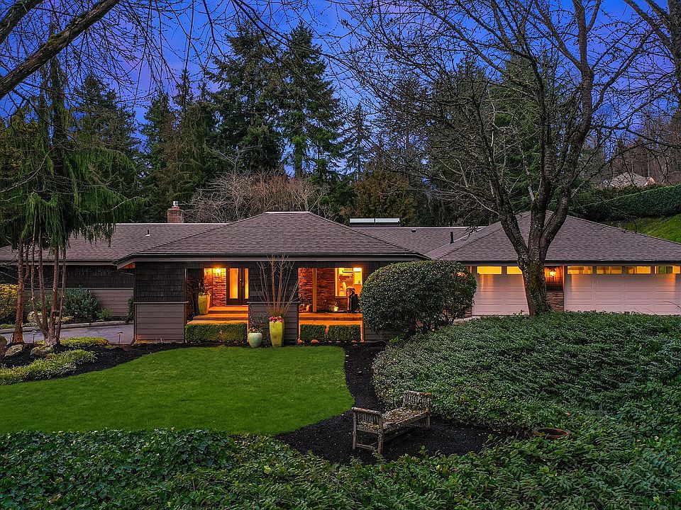 Open the door to a true oasis situated in the coveted Bridle Trails community