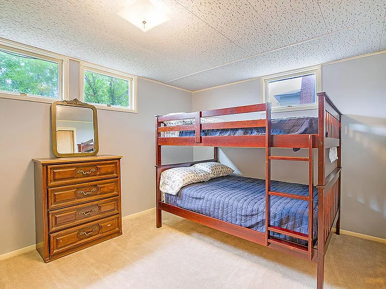 Other downstairs bedroom. Two sets of bunk beds that was be moved or packed away