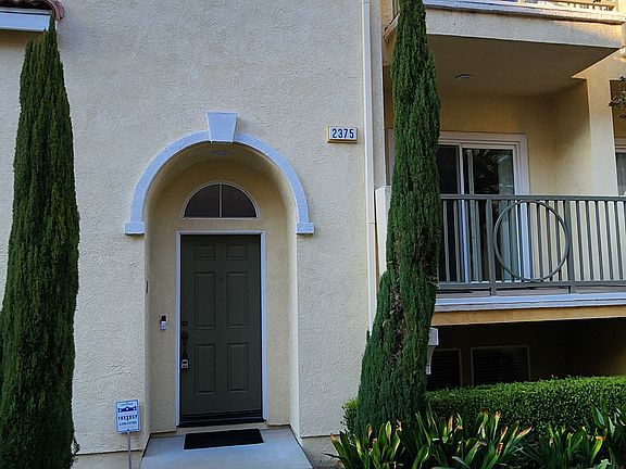 Front view of the house with 2 small balconies