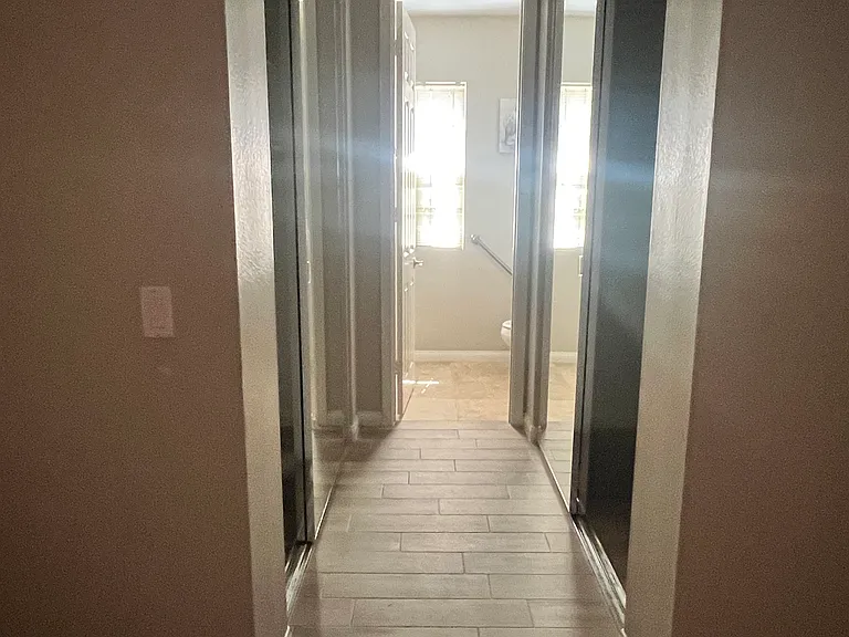Hallway in Bedroom #1 with two closets