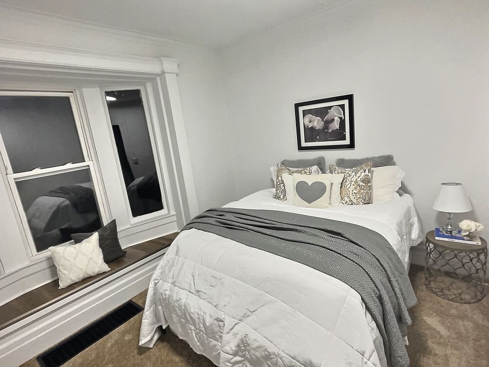 spacious bedroom with fresh paint and new carpet