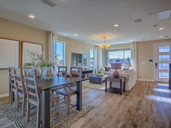 Wood-look tile flooring on the first floor including entry, gathering room, cafe and kitchen.