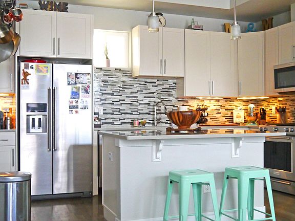 Open Kitchen with tile backsplash