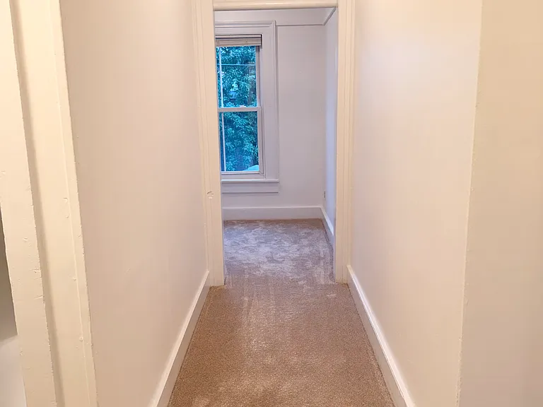 Hallway to office nock and upstairs bedroom.