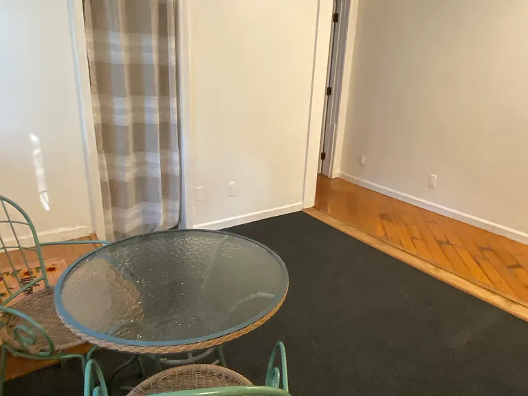 Optional sitting area with coat closet and living space shown