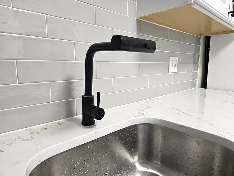 Modern sink and matte black faucet