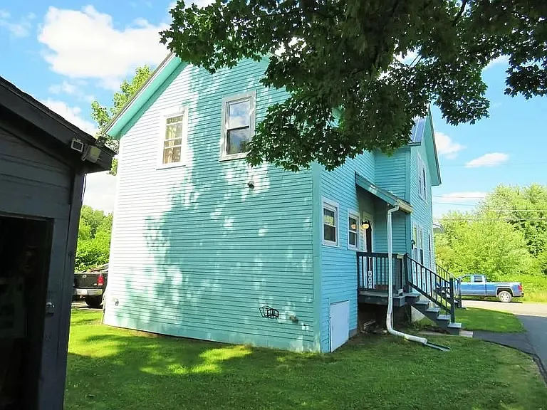 Rear of house, showing private porch off driveway