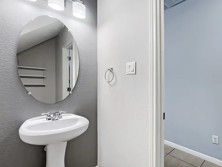 Half bath downstairs with storage space