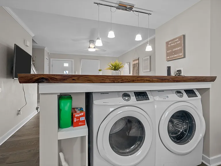Full sized washer and dryer under the island.
