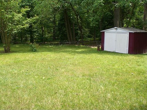 huge 1/2 acre back yard with shed/workshop -- great for kids, gardening, etc.