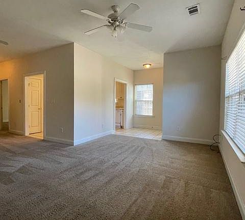 Living Room - Ceiling fan and blinds on all windows