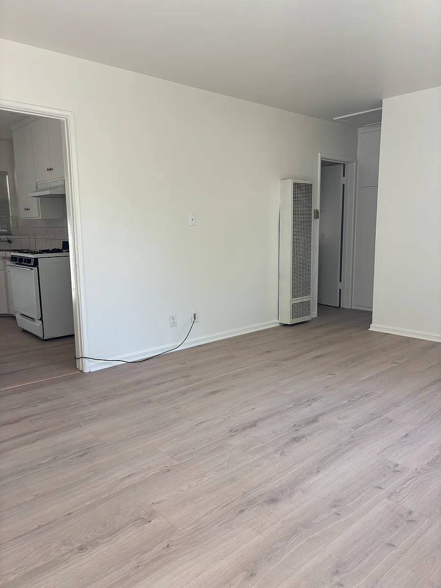 Living room with view towards bedroom and kitchen - 836 Fischer St #D
