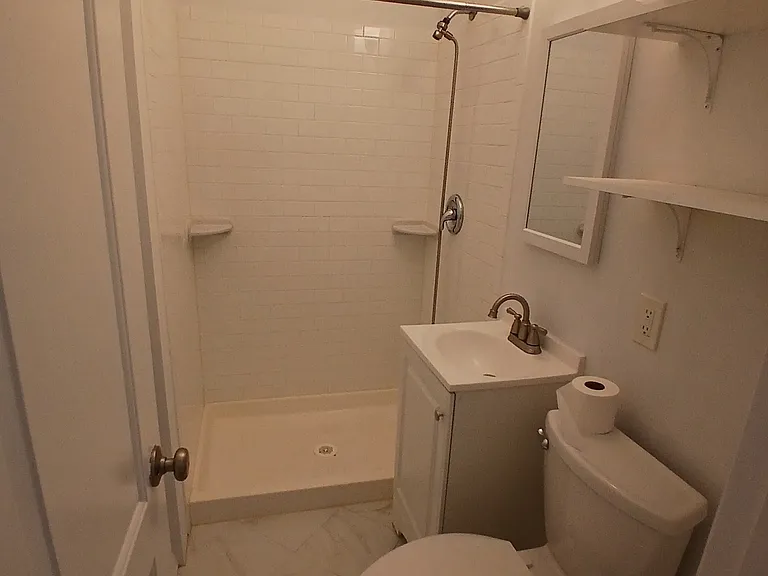 Bathroom with shower, no tub.