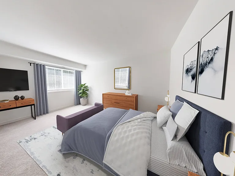 Well appointed bedroom with plush wall to wall carpeting