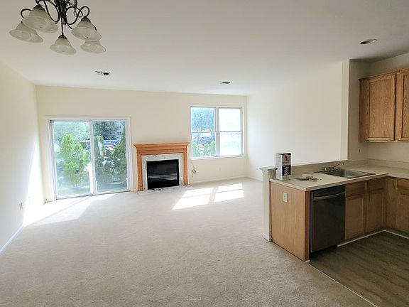 Great room with gas fireplace (new carpeting)