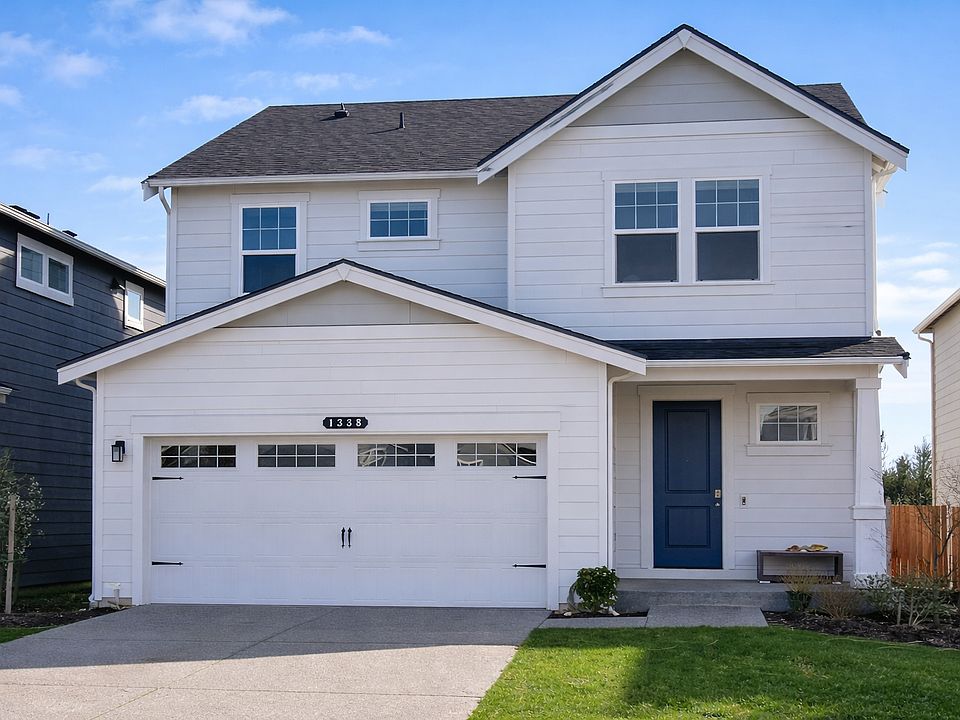 Front Yard, front entrance, and garage.