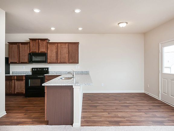 Gorgeous granite countertops overlooking entertainment space