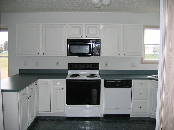 Large kitchen with white cabinets
