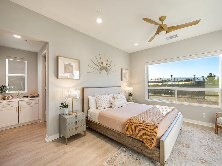 The master suite has amazing views to the outdoor space and golf course view!