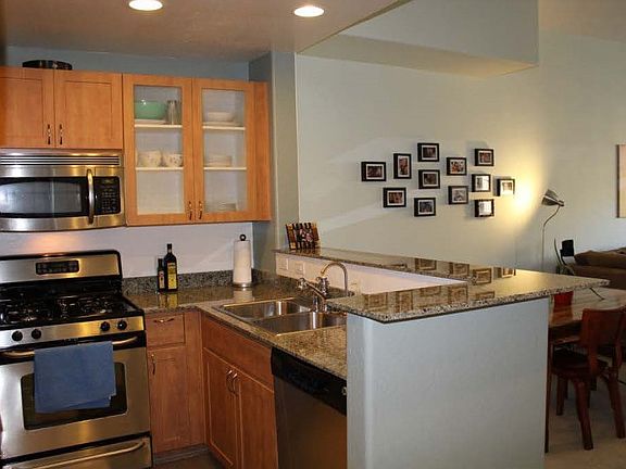 View of kitchen and partial view of dining area (from entry)