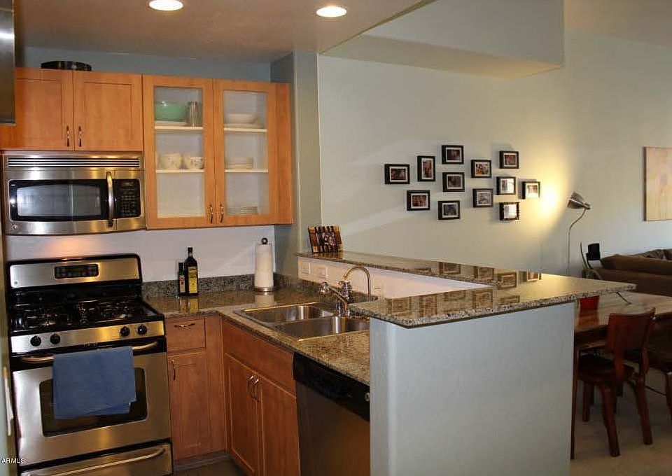 View of kitchen and partial view of dining area (from entry)