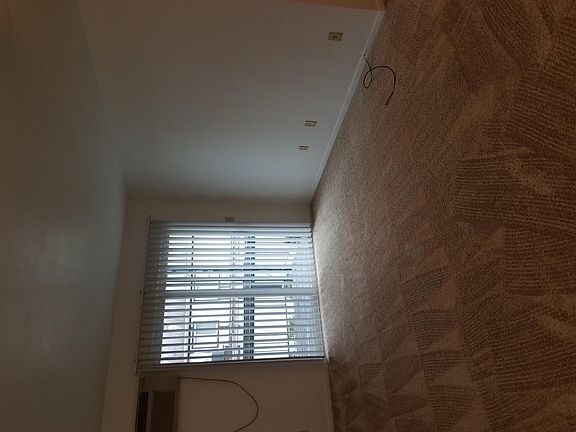 Living room with new sliding glass door /vertical blind