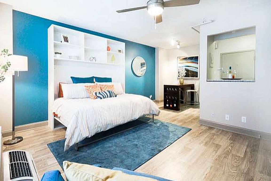 Bedroom with hardwood-style flooring and ceiling fan