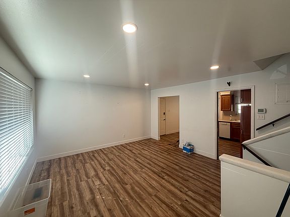 Living area with closet at front door and large picture window