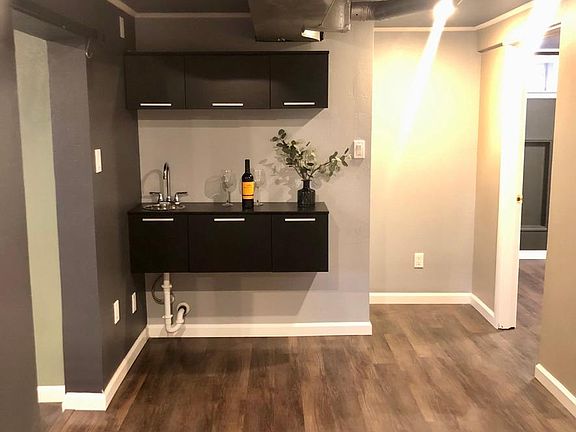 Wet bar centrally in a centrally located foyer