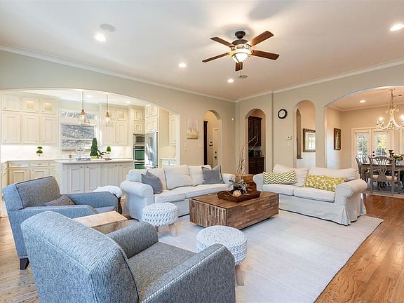 Another view from the living area showing kitchen and dining area as well as a nice wet bar and mud room from garage.