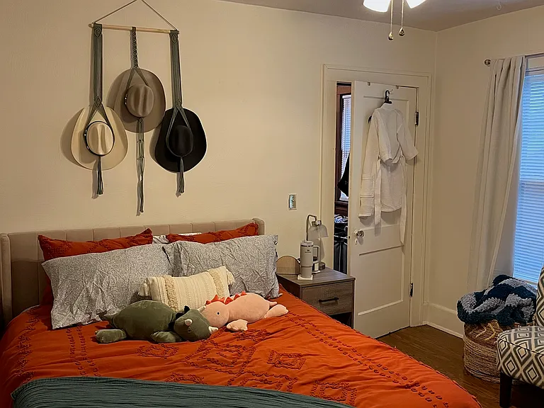 Bedroom One w/ Designer Ceiling Fan and Two Large Windows.
