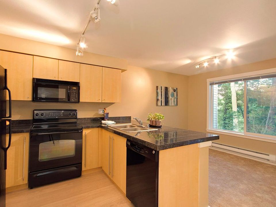 Unit Now has Stainless Appliances and BRAND NEW wide plank hard surface flooring! New photos coming soon!