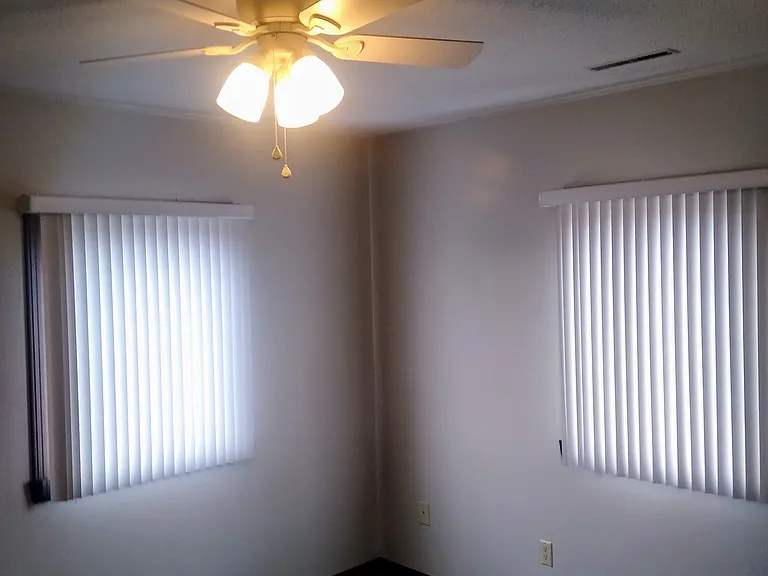 2 opening windows and 2 closets in this bedroom.