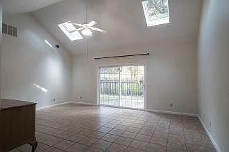 Skylights and vaulted ceilings in the living room provide natural light throughout.