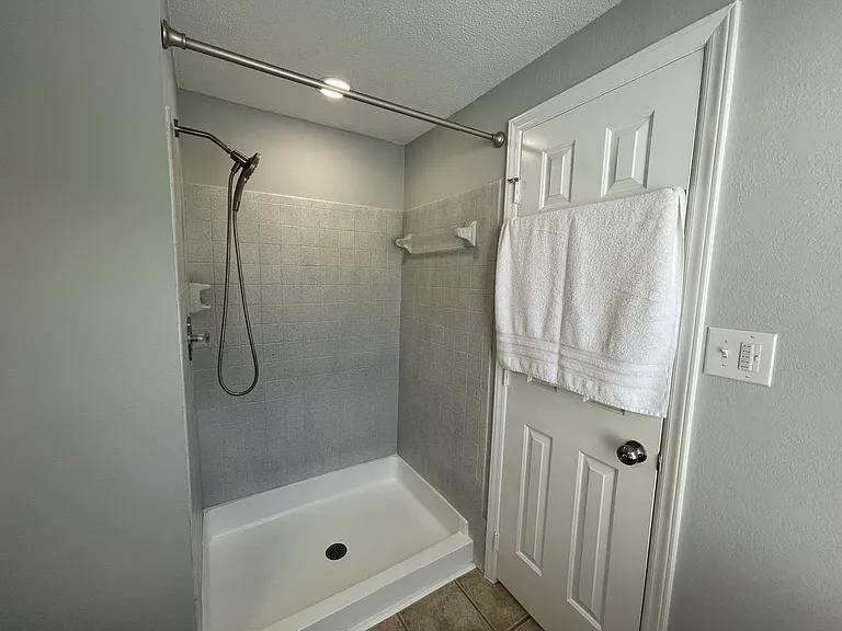 New walk-in shower with handheld shower head