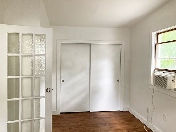 Sunny Queen-Size Bedroom with Large Closet