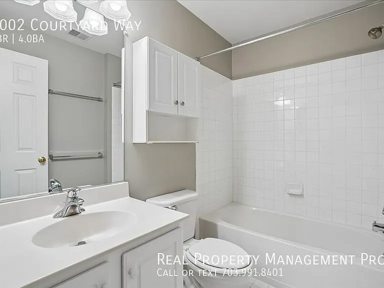 7002 Courtyard Way — Photo 31