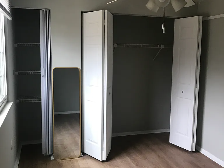 Second bedroom with large closet and ceiling fan