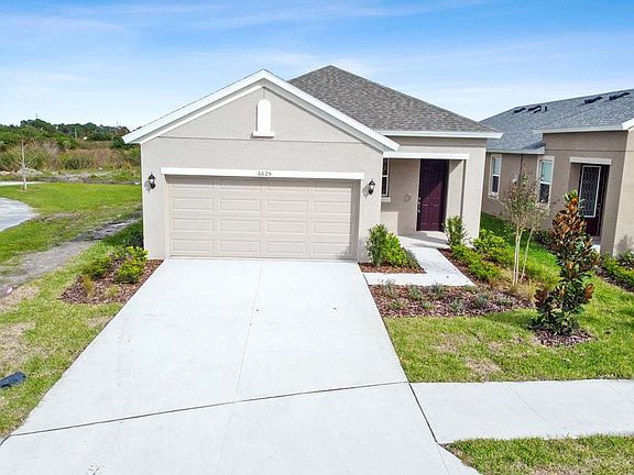 Flora new construction open concept floor plan tuscan elevation at BridgeWater Lakeland, FL by Willi