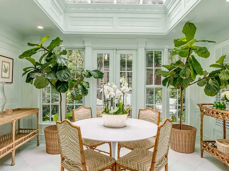Sunroom with breakfast/dinning table.