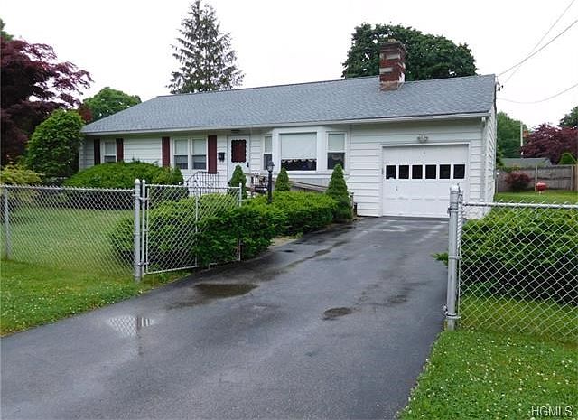 House sits perfectly on level corner 1/4 acre lot