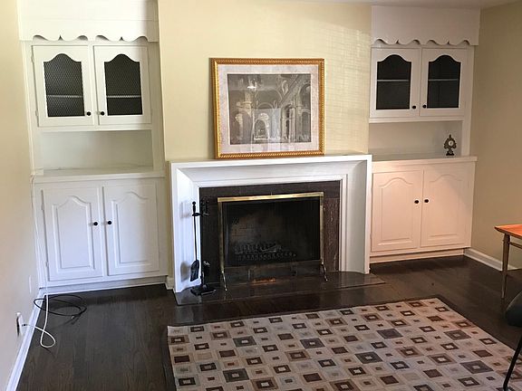 Living Room. Built-ins. Hardwood Floors. Woodburning Firepla