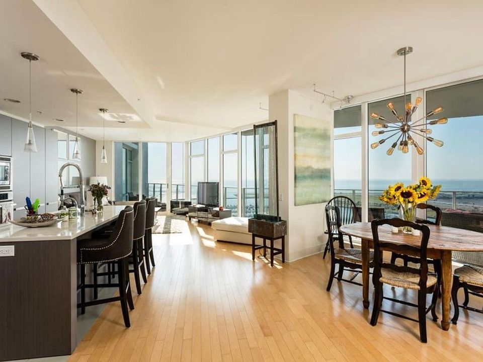 First Floor of 2 story condo. Open Kitchen, Living, Dining Floor to ceiling Windows-water views from every window