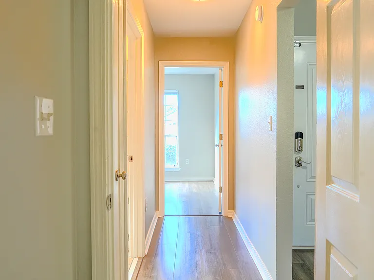 hallway to 2 guest bedrooms and guest bathroom
