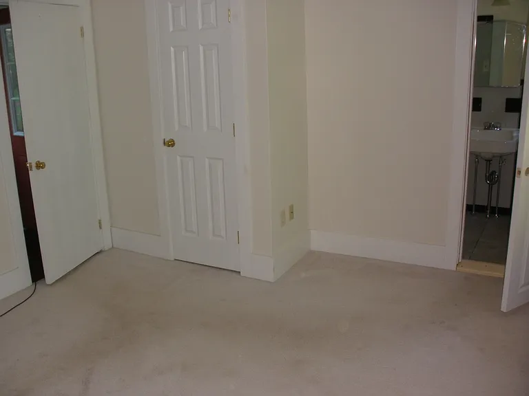 BR with hallway door on left; walk-in closet in middle and bath entrance to the right