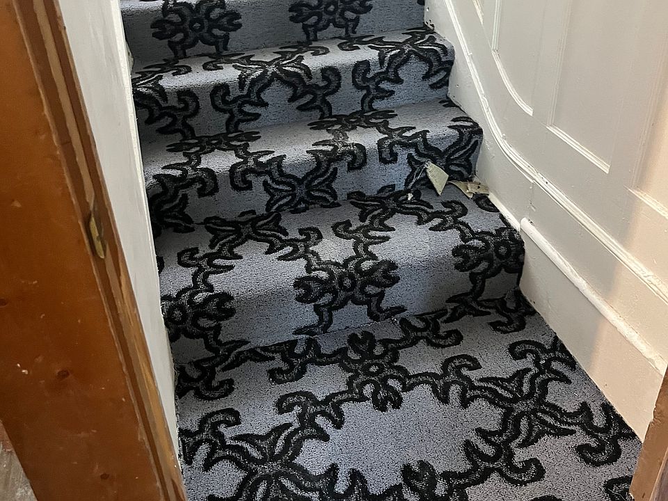 Front stairwell leading to the second and third floor units.